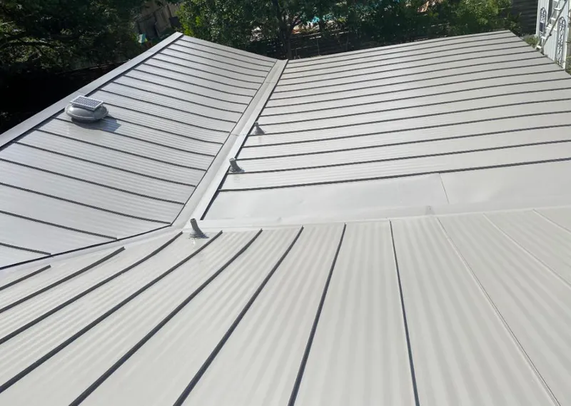 Solar attic fan installed on a metal roof for Roof Ventilation in Kinross